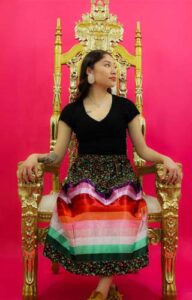 Woman sitting on a throne chair